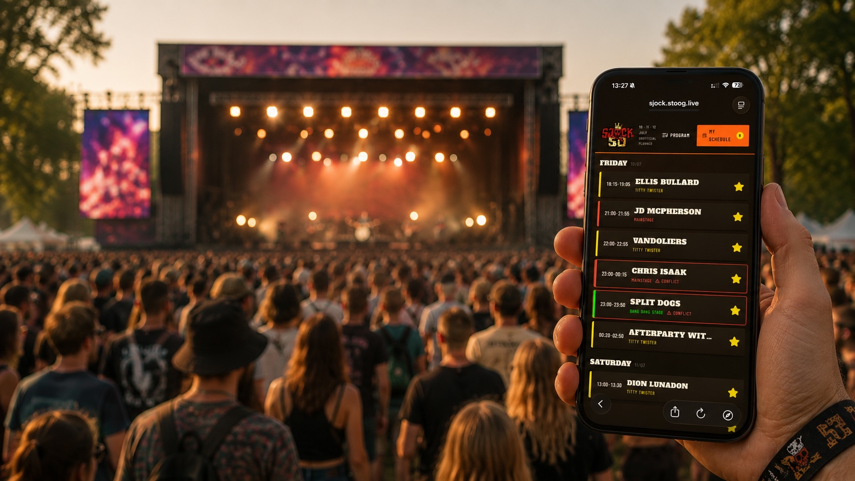 Festival visitor holding a phone showing the Sjock schedule on sjock.stoog.live in front of a packed main stage at sunset